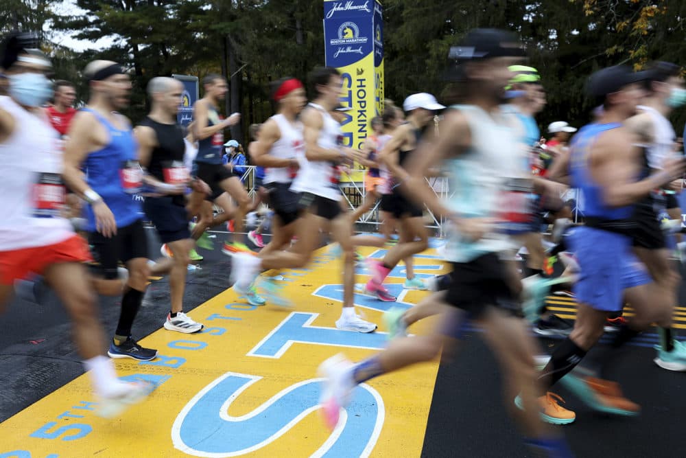 Runners cross the starting line of the 125th Boston Marathon, Oct. 11, 2021, in Hopkinton, Mass. (Mary Schwalm/AP File)