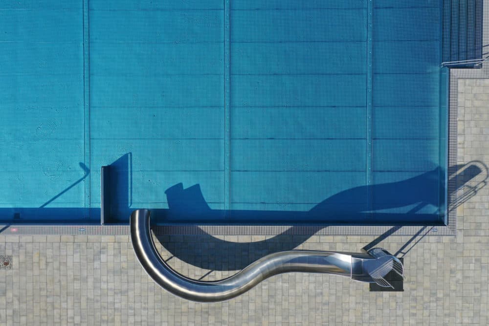 In this aerial view a slide stands at a pool at the Kiebitzberge public swimming pools near Berlin during the coronavirus crisis on April 28, 2020 in Kleinmachnow, Germany. (Sean Gallup/Getty Images)