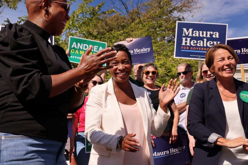 Andrea Campbell, candidate for Attorney General is flanked by United States Rep. Ayanna Pressley, left, and Attorney General and candidate for governor Maura Healey during a canvassing event at America's Food Basket in the Hyde Park neighborhood on September 3, 2022. (Craig F. Walker/The Boston Globe via Getty Images)