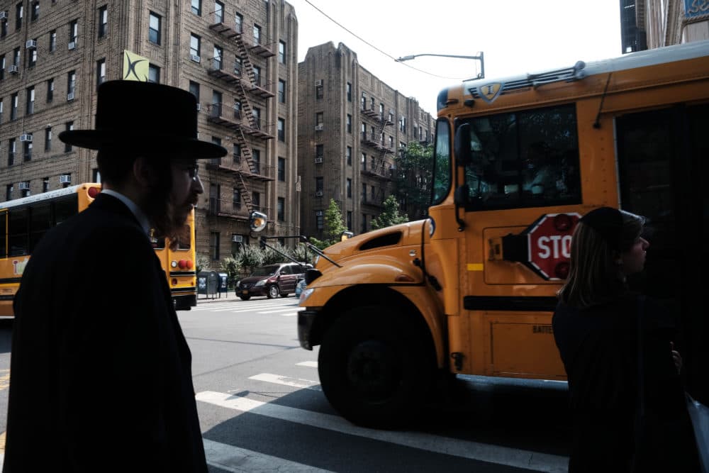 A yeshiva school bus drives through Borough Park on Sept. 12, 2022 in the Brooklyn borough of New York City. (Spencer Platt/Getty Images)