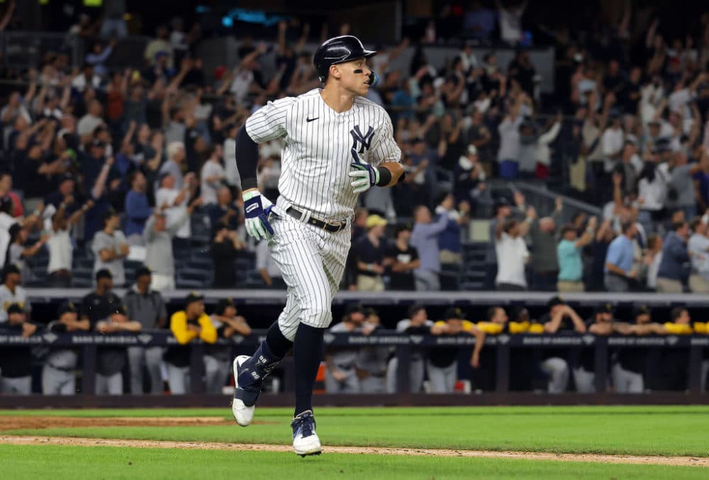 Aaron Judge #99 of the New York Yankees hits his 60th home run of the season during the 9th inning of the game against the Pittsburgh Pirates at Yankee Stadium on Sept. 20, 2022 in the Bronx borough of New York City. (Jamie Squire/Getty Images)