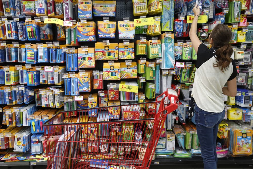 A teenager shopping for school supplies. (Philippe Lissac/Getty Images)