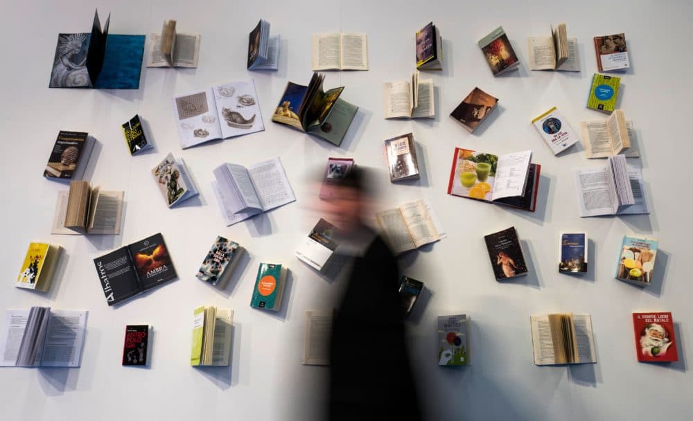 A visitor walks past a book display at the Frankfurt Book Fair. (John MacDougall/AFP via Getty Images)