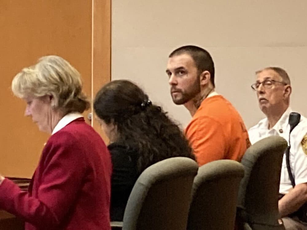 Adam Montgomery, with defense attorneys Caroline Smith, far left, and Paige Pihl-Buckley in a Manchester New Hampshire court hearing on Sept. 28, 2022. (Kathy McCormack/AP)