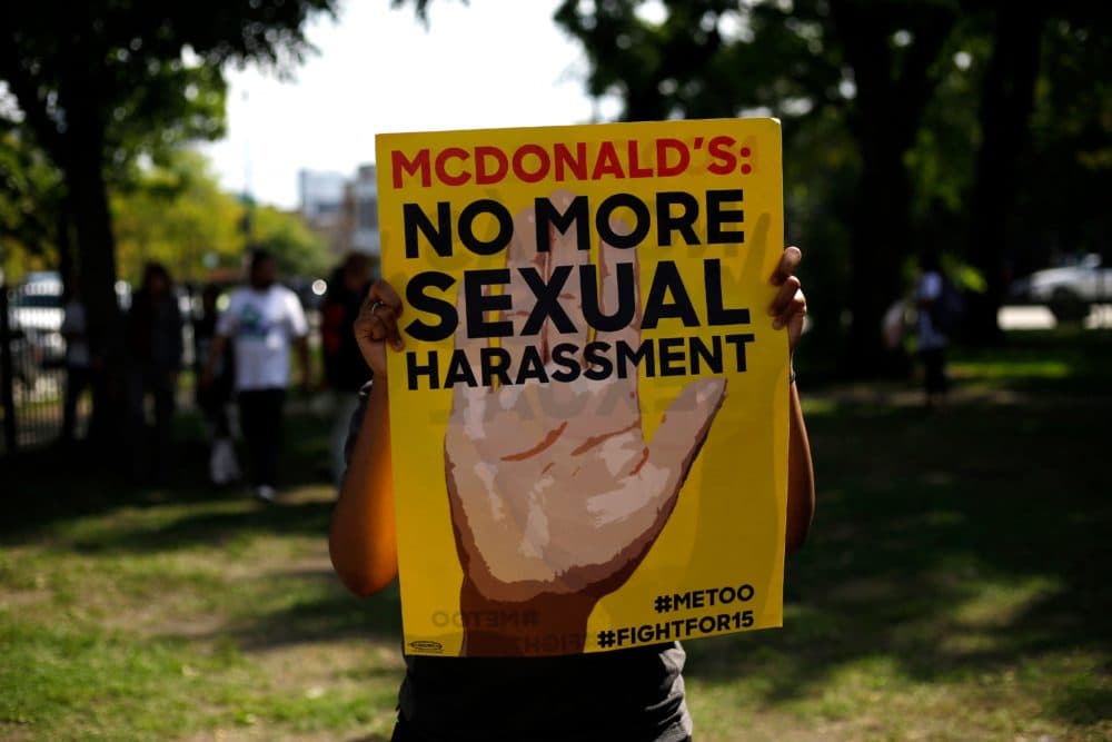 A McDonald's employee holds a sign during a protest against sexual harassment in the workplace on Sept. 18, 2018 in Chicago, Illinois.(Joshua Lott/AFP via Getty Images)