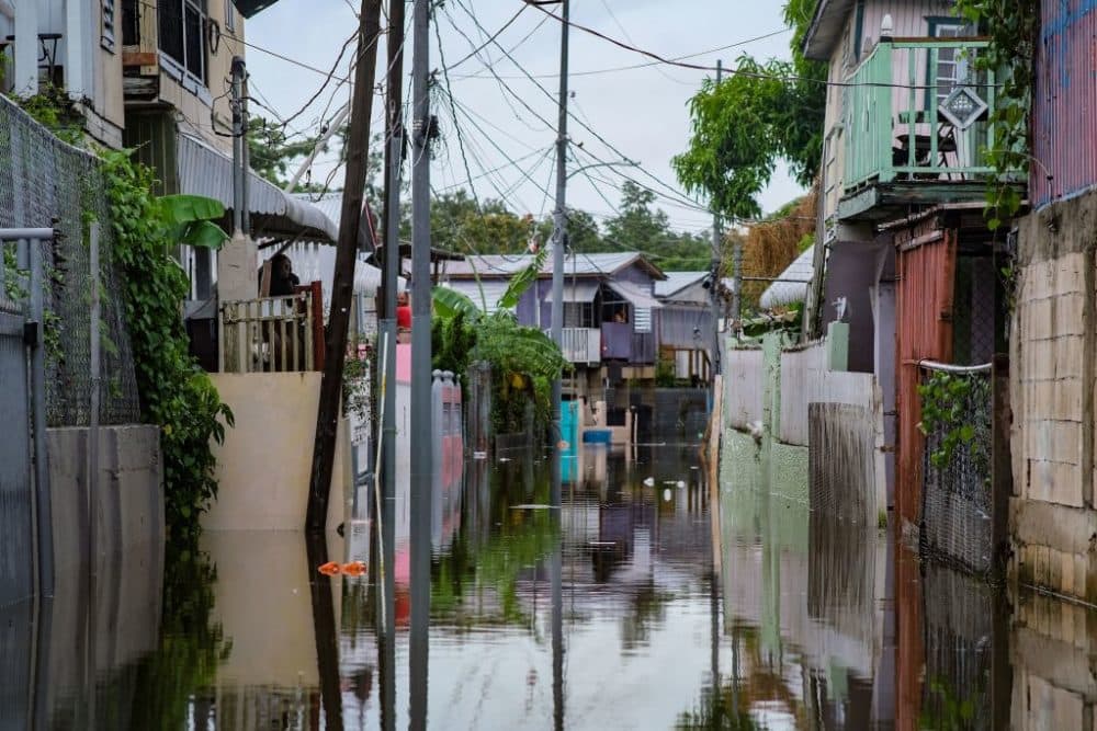 A flooded street is seen in the Juana Matos neighborhood of Catano, Puerto Rico, on September 19, 2022, after the passage of Hurricane Fiona. - Hurricane Fiona smashed into Puerto Rico, knocking out the US island territory's power while dumping torrential rain and wreaking catastrophic damage before making landfall in the Dominican Republic on September 19. (Photo by AFP) (Photo by -/AFP via Getty Images)
