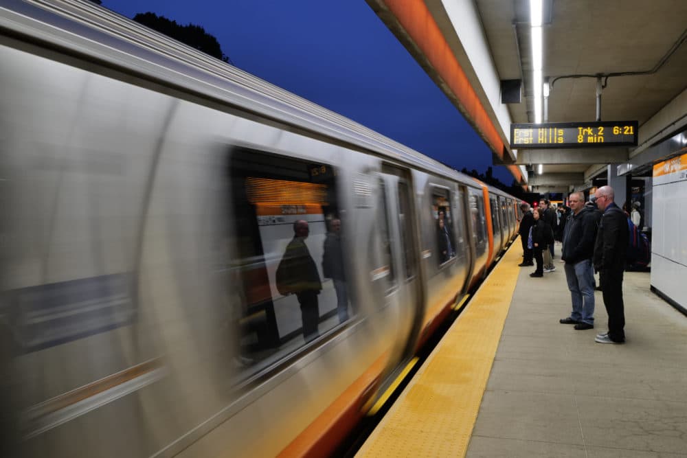 Commuters wait to board an Orange Line train inbound into Boston from Oak Grove on the MBTA Orange Line on the first day of its reopening after a one month shutdown for renovations. (Carlin Stiehl for The Boston Globe via Getty Images)