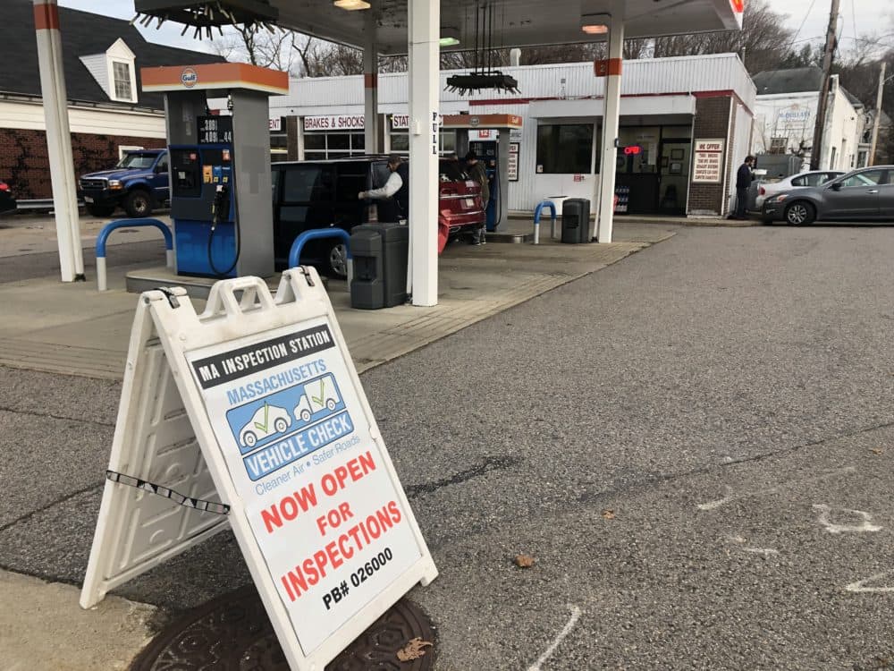 A Massachusetts car inspection sign in front of a Gulf gas station in Boston. (Lindsey Nicholson/UCG/Universal Images Group via Getty Images)