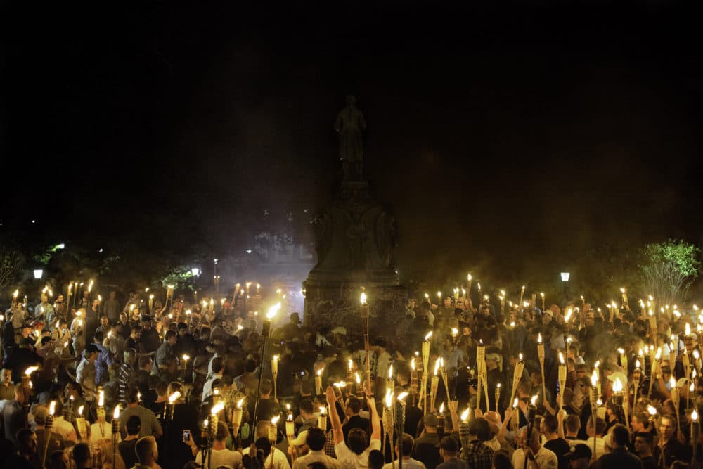 Neo Nazis and White Supremacists encircle counter protestors at the base of a statue of Thomas Jefferson after marching through the University of Virginia campus with torches in Charlottesville, Va., USA on August 11, 2017 (Shay Horse/NurPhoto via Getty Images)