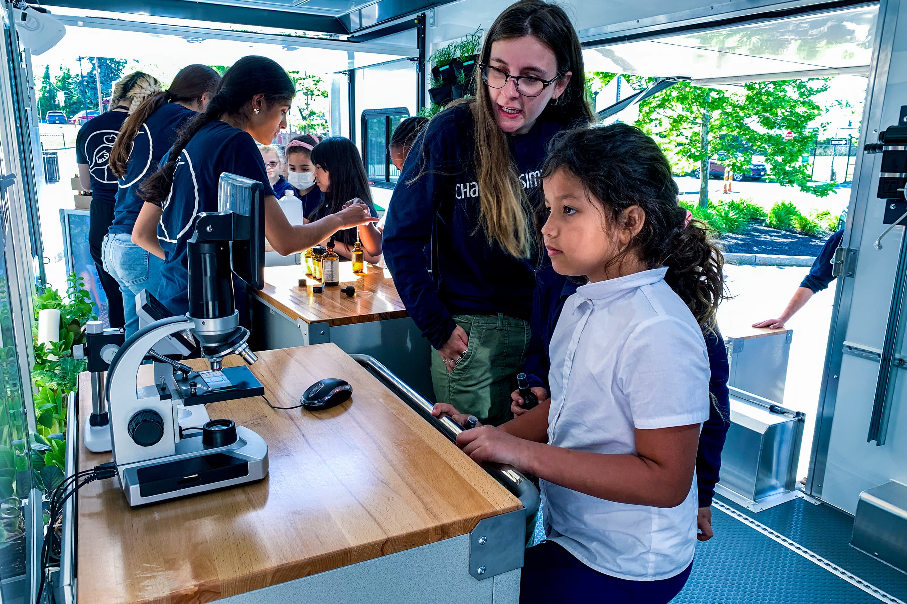 Change is Simple program director Skye Fournier with a Paul Revere Elementary student inside the nonprofit's mobile learning lab. (Courtesy Change is Simple)