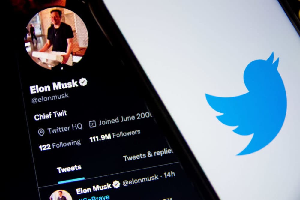 A Twitter logo seen displayed on a smartphone screen with now-owner Elon Musk. (Photo by Nikolas Kokovlis/NurPhoto via Getty Images)