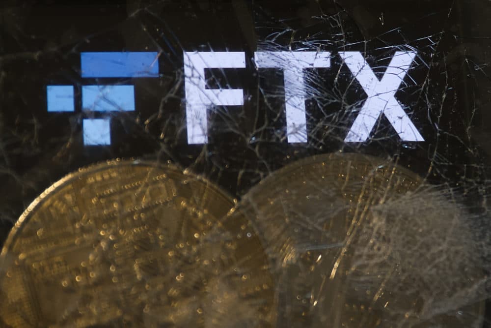FTX logo displayed on a phone screen and representation of cryptocurrencies are seen through the broken glass in this illustration photo taken in Krakow, Poland on November 14, 2022. (Photo by Jakub Porzycki/NurPhoto via Getty Images)