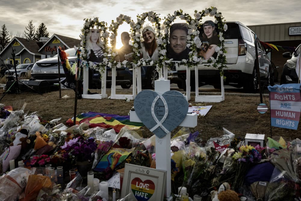 Photos of the shooting victims are displayed at a makeshift memorial outside of Club Q on Nov. 22, 2022 in Colorado Springs, Colorado. A gunman opened fire inside the LGBTQ+ club on Nov. 19, killing 5 and injuring 25 others before being tackled and disarmed by a club patron. (Chet Strange/Getty Images)