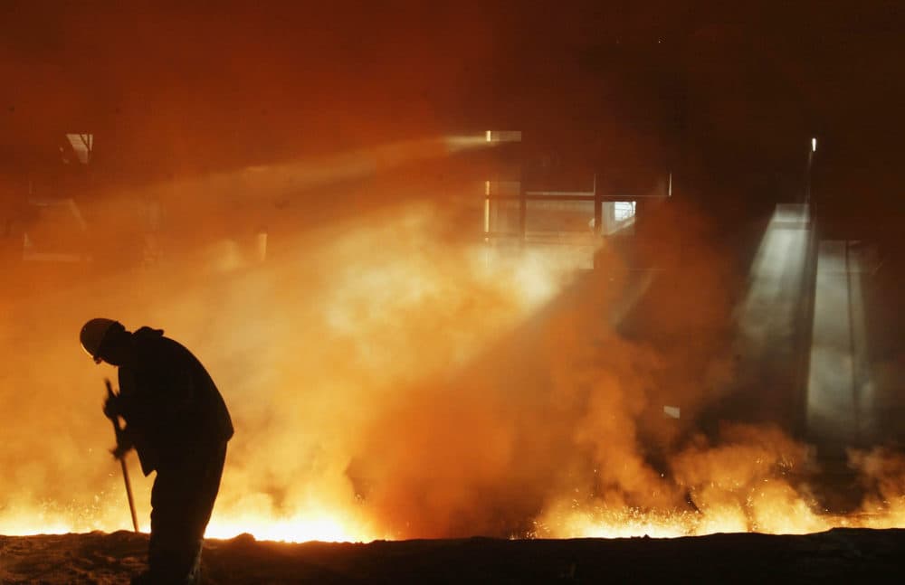 A steelworker works at a steel mill. (China Photos/Getty Images)