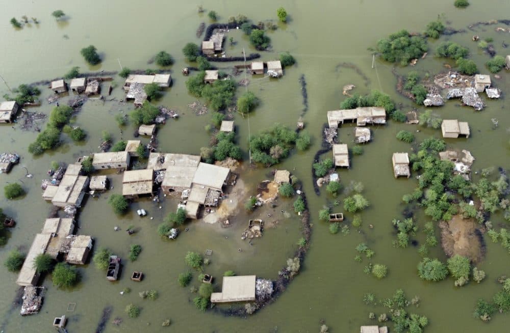 Homes are surrounded by floodwaters in Sohbat Pur city, a district of Pakistan's southwestern Baluchistan province. (Zahid Hussain/AP)