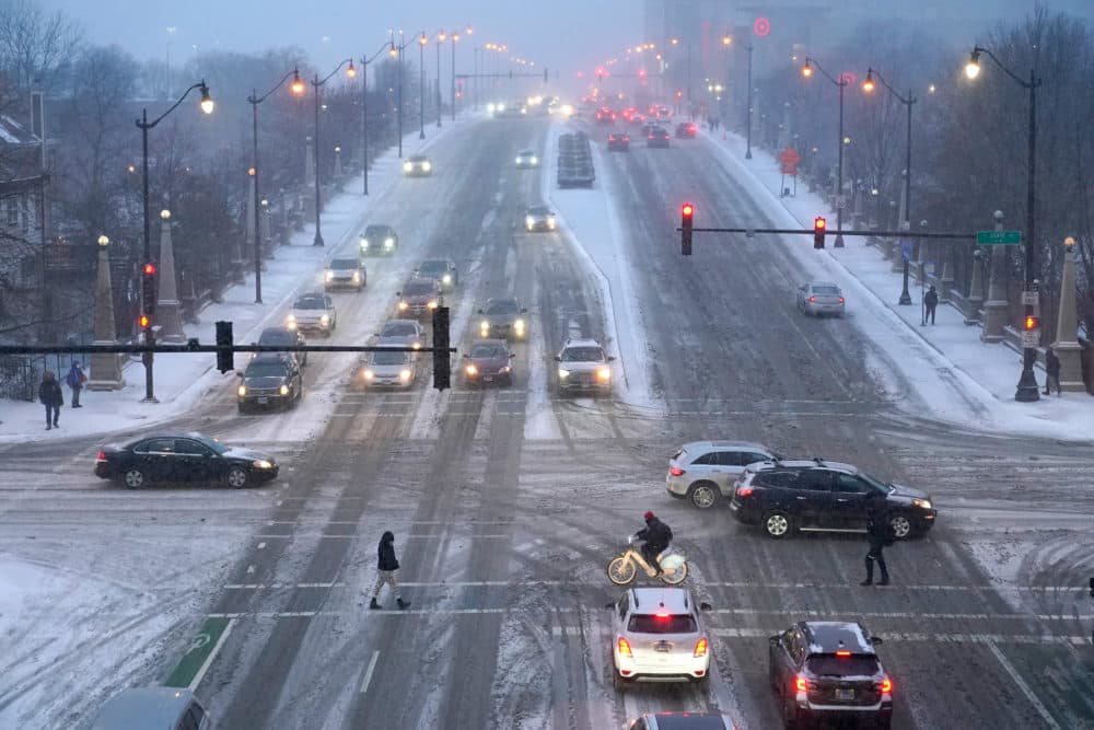 Pedestrians navigate slippery streets in Chicago. (Charles Rex Arbogast/AP)
