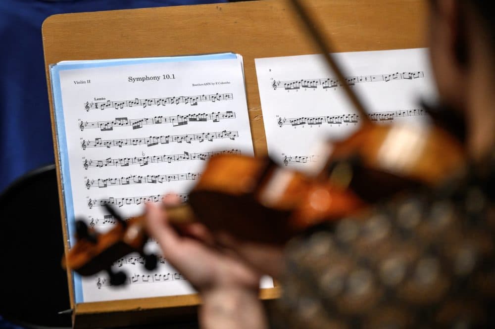 A violinist of Nexus orchestra performs during a rehearsal in Lausanne on Sept. 2, 2021. (Fabrice Coffrin/AFP via Getty Images)