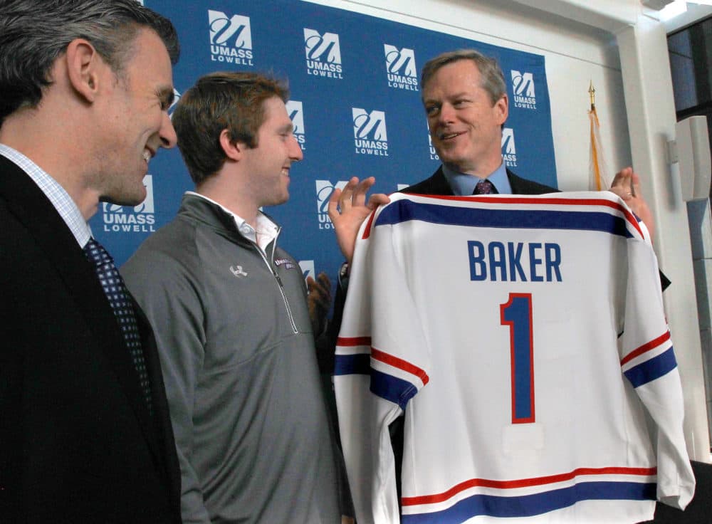 Gov. Charlie Baker with a UMass Lowell hockey jersey in 2015. (John Blanding/The Boston Globe via Getty Images)
