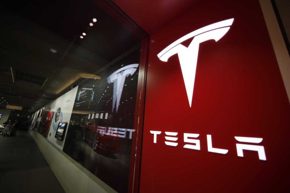 The Tesla logo is seen at a company store. (David Zalubowski/AP)