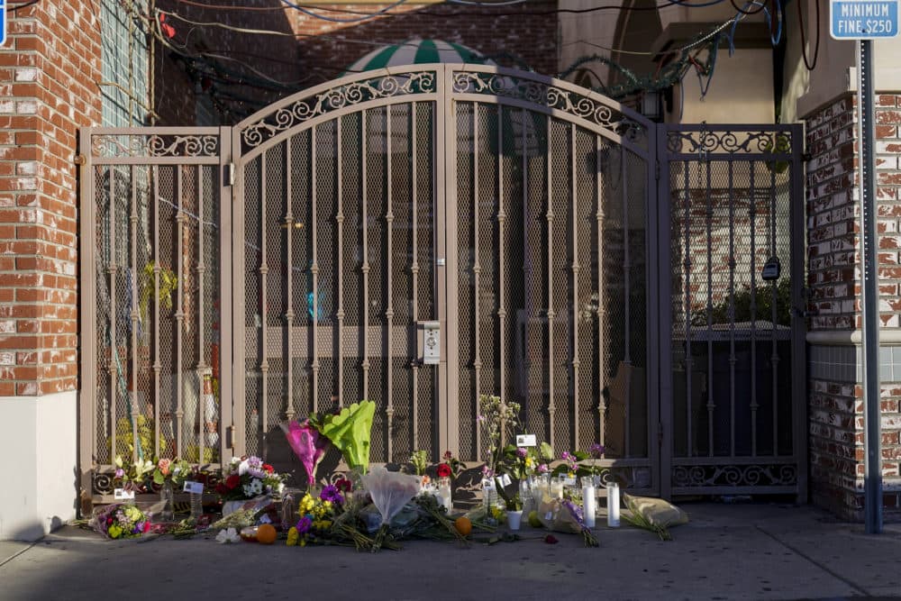 Flowers are placed at the entrance to Star Dance Studio in Monterey Park, Calif., Monday, Jan. 23, 2023. Authorities searched for a motive for the gunman who killed 10 people at the ballroom dance club during Lunar New Year celebrations, slayings that sent a wave of fear through Asian American communities and cast a shadow over festivities nationwide. (Jae C. Hong/AP)