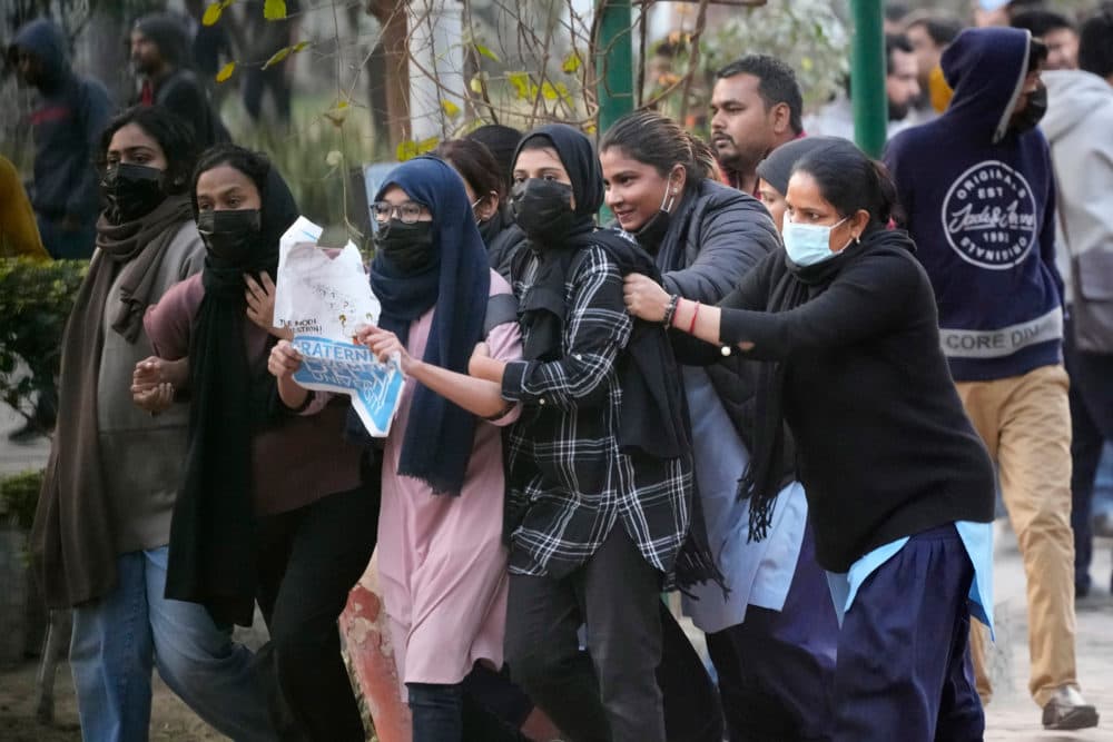 Tensions escalated Delhi University after a student group said it planned to screen a banned documentary that examines Indian Prime Minister Narendra Modi's role during 2002 anti-Muslim riots. (Manish Swarup/AP)