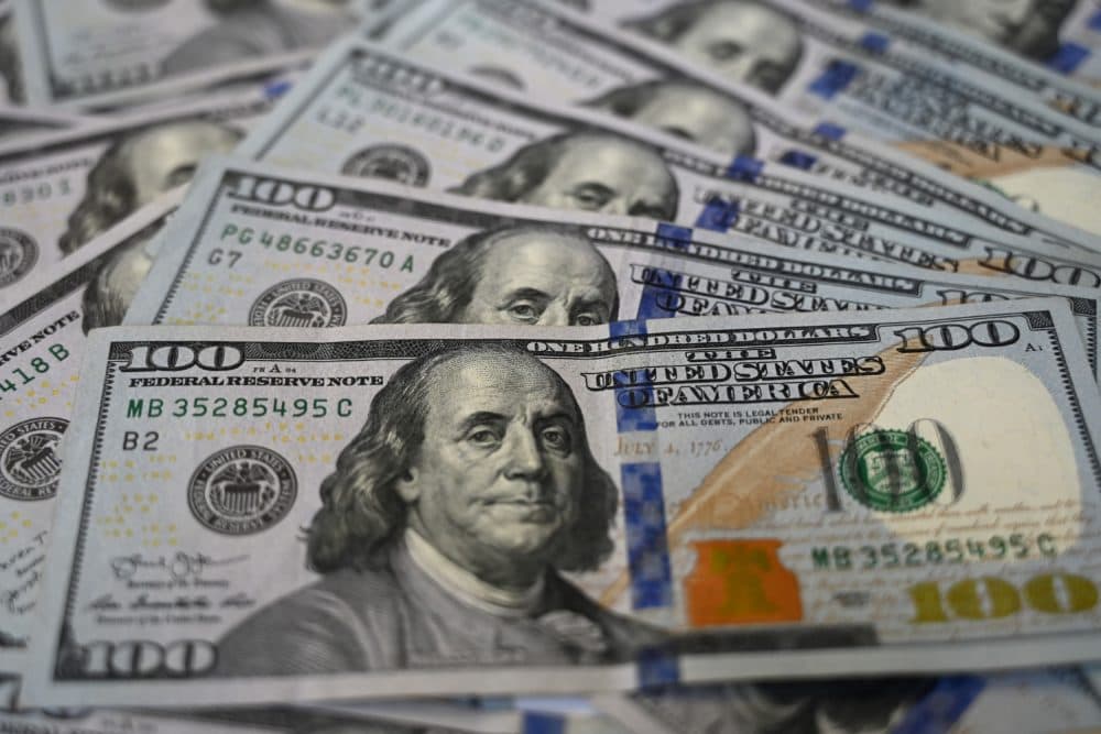 A pile of U.S. $100 bills (Ozan Kose/AFP via Getty Images)