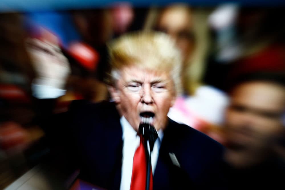 A slow shutter speed image of former U.S. president Donald Trump on a TV screen is seen in this photo illustration in Warsaw, Poland on 23 February, 2022. (STR/NurPhoto via Getty Images)