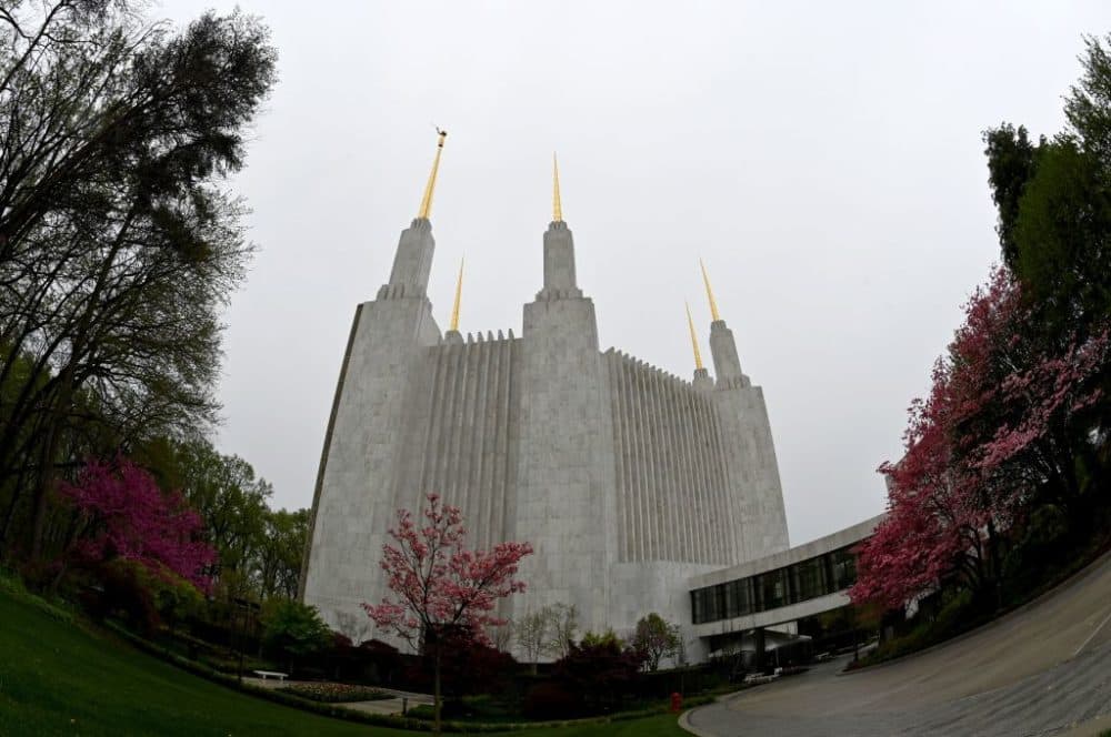 View of the temple of the Church of Jesus Christ of Latter-Day Saints with its six spires in Kensington, Maryland, near Washington, DC, April 18, 2022. - Like something out of a science fiction novel, with its six golden spires and pristine white walls, the Mormon Temple in Washington, DC, has intrigued those who have seen it for decades but have never been able to enter it. Their curiosity will soon be satisfied: for the first time in almost half a century, the temple will open its doors to the public. (Photo by Eva HAMBACH / AFP) (Photo by EVA HAMBACH/AFP via Getty Images)