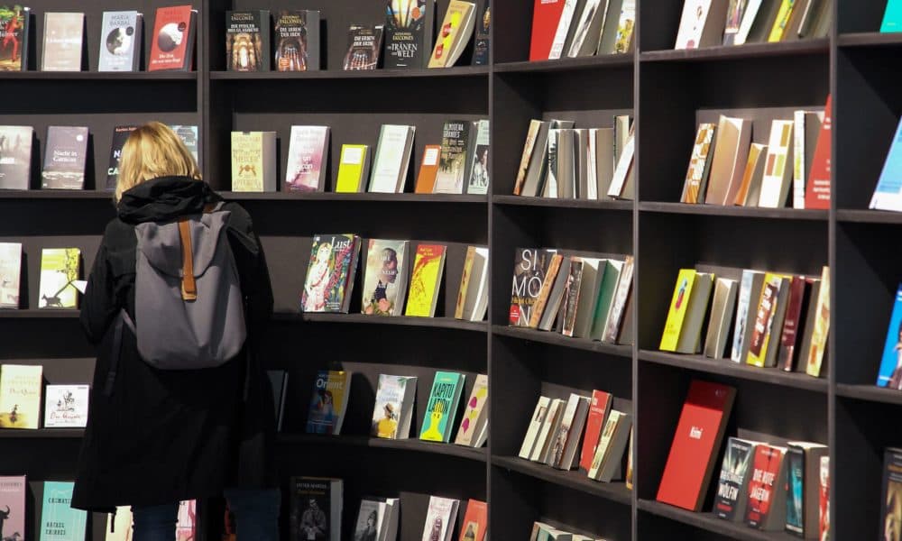 A visitor looks at books displayed. (Daniel Roland/AFP via Getty Images)