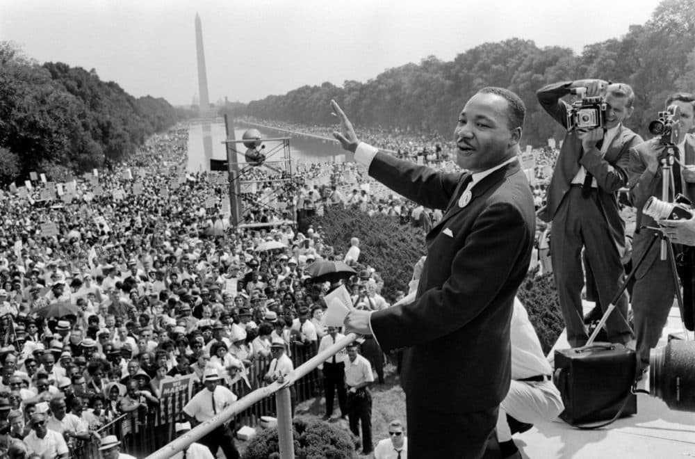 The civil rights leader Martin Luther King Jr., center, waves to supporters Aug. 28, 1963 on the Mall in Washington DC during the March on Washington. King said the march was &quot;the greatest demonstration of freedom in the history of the United States. (AFP via Getty Images)