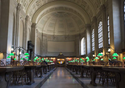 Empty desks line the Boston Public Library's Reading Room in Boston in 2020. (Blake Nissen for The Boston Globe via Getty Images)