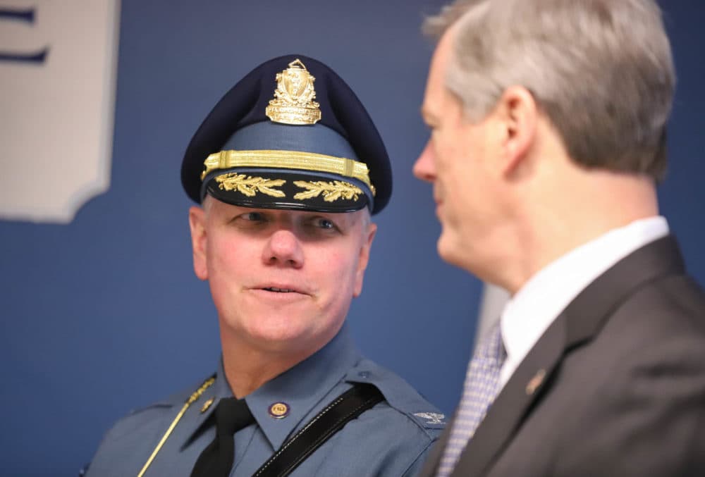 Col. Chris Mason, superintendent of the State Police, talks with Gov. Charlie Baker at a press conference in 2020. (Sam Doran/SHNS)