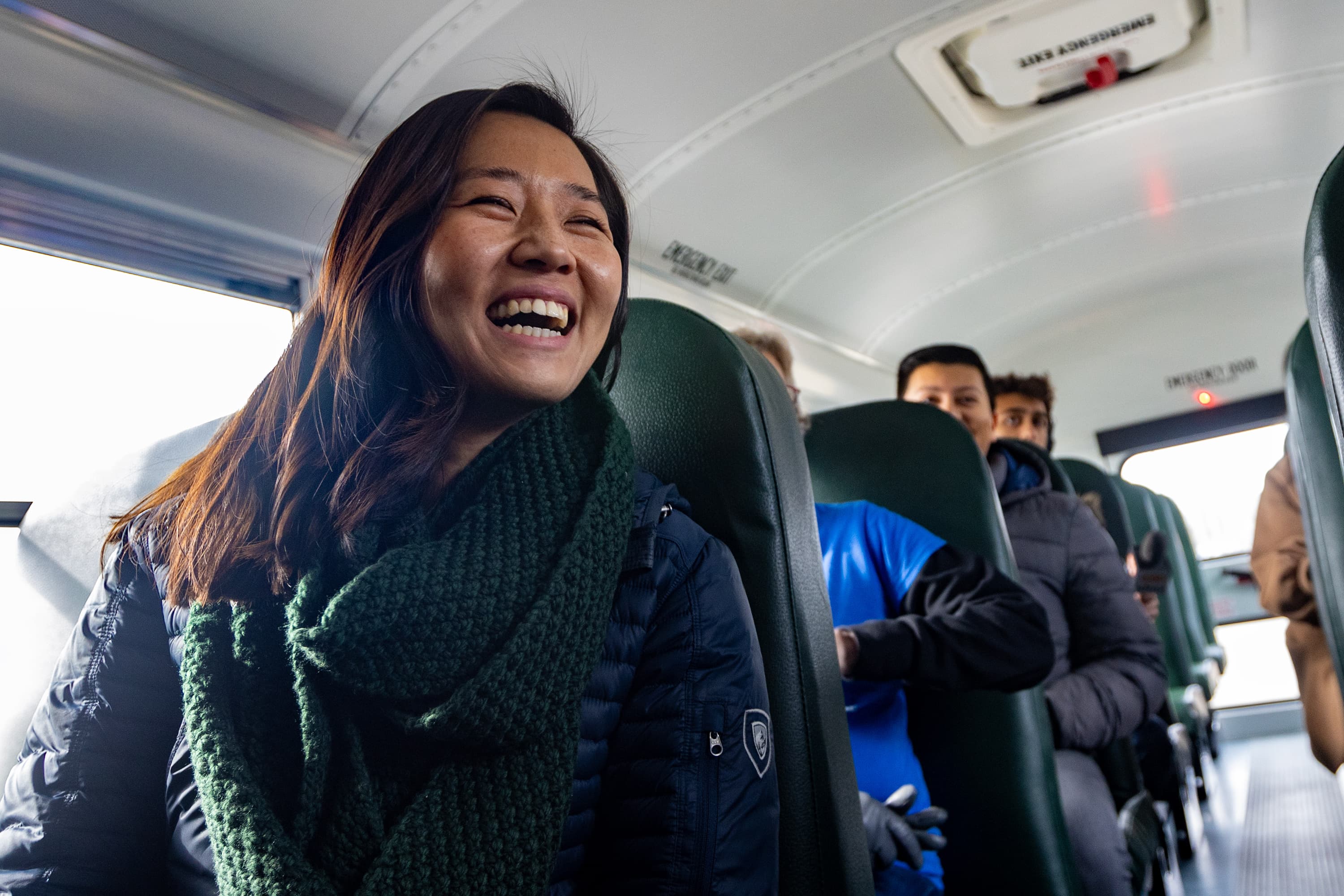 Mayor Michelle Wu smiles during her ride in the first electric school bus added to the Boston Public Schools’ fleet. (Jesse Costa/WBUR)
