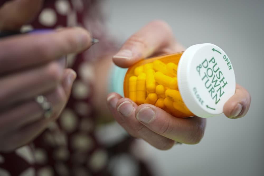 A pharmacist fills a prescription. (Chris Carlson/AP)