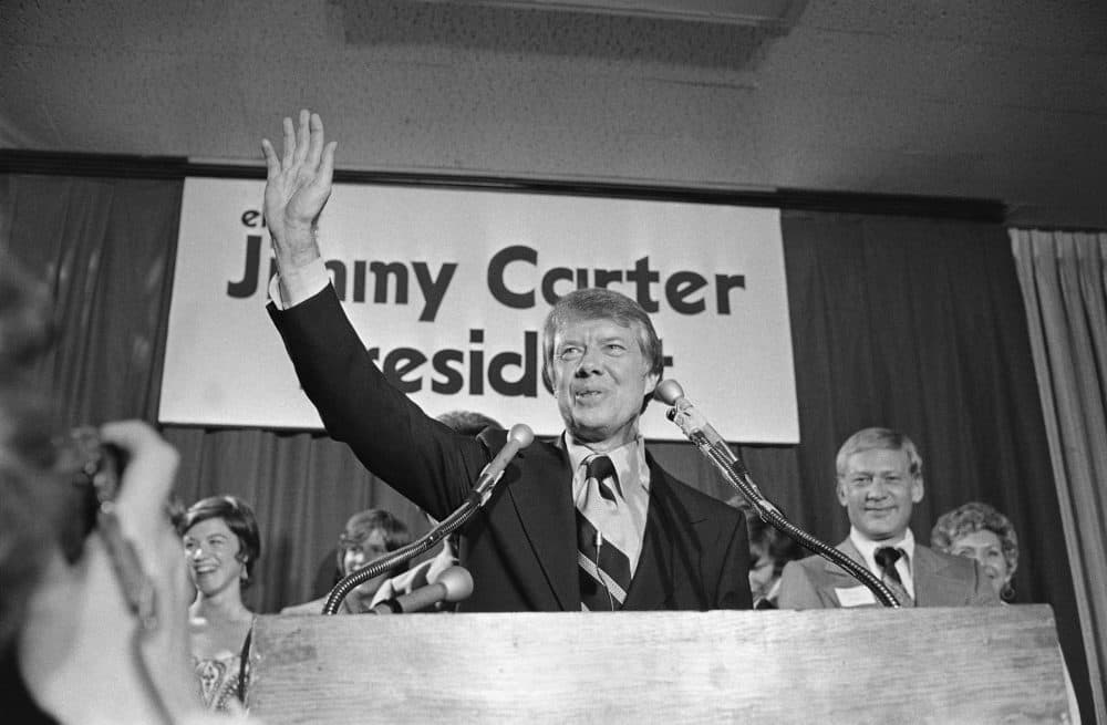 Then Georgia Gov. Jimmy Carter waves to a crowd gather in Atlanta on Thursday, Dec. 12, 1974 where he announced officially that is a Democratic candidate for the presidency. (AP Photo/BJ)