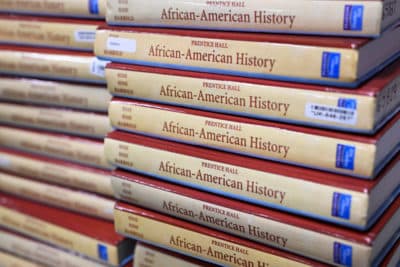 Books are piled up in the classroom for students taking AP African American Studies at Overland High School on November 1, 2022 in Aurora, Colorado.  (RJ Sangosti/MediaNews Group/The Denver Post via Getty Images)