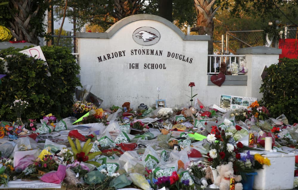 Flowers, candles and mementos sit outside one of the makeshift memorials at Marjory Stoneman Douglas High School in Parkland, Florida on Feb. 27, 2018. (Rhona Wise/AFP via Getty Images)