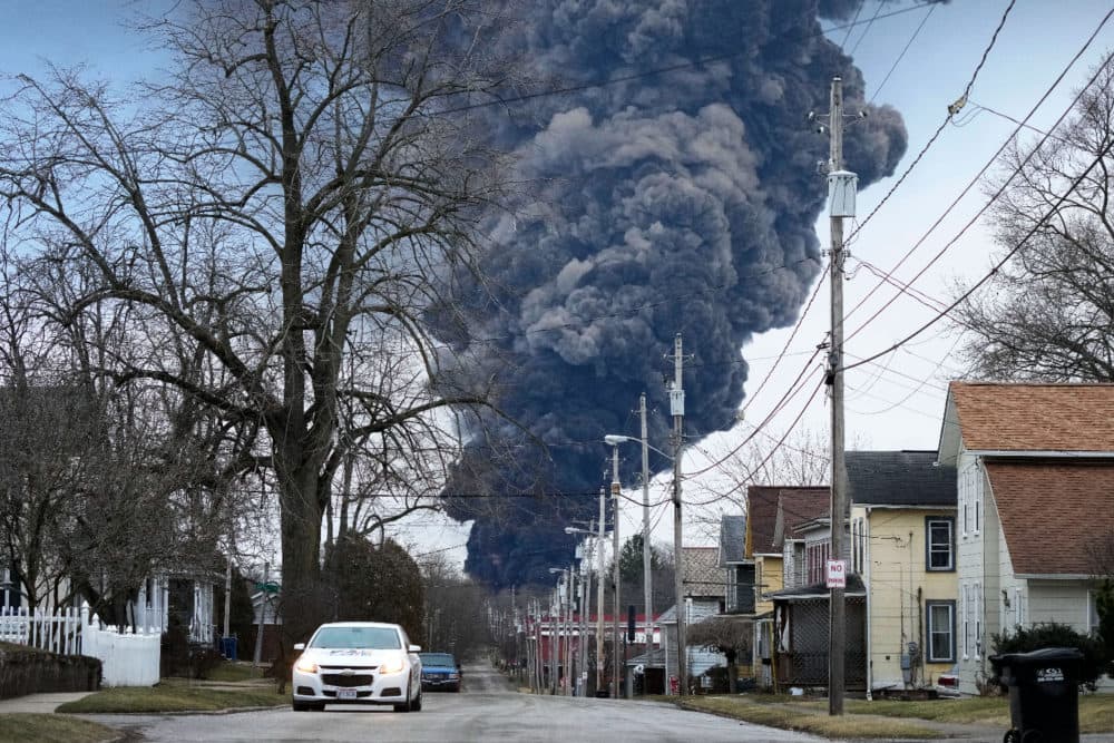 A black plume rises over East Palestine, Ohio, as a result of a controlled detonation of a portion of the derailed Norfolk Southern trains, on Feb. 6, 2023. (Gene J. Puskar/AP)