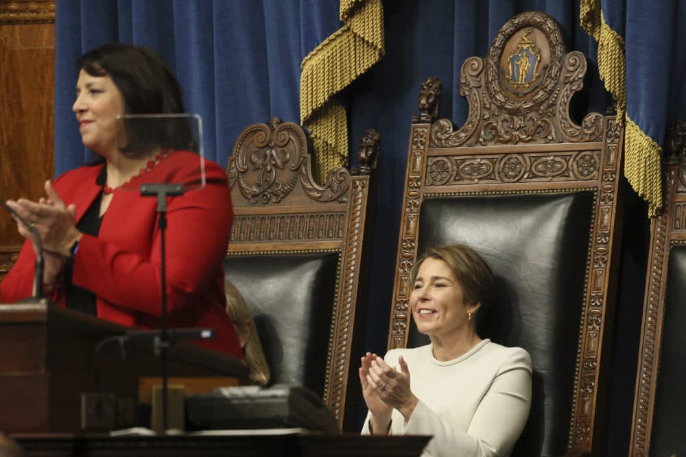 Gov. Maura Healey, right, applauds as Lt. Governor Kim Driscoll addresses those in attendance at their inauguration in the House Chamber on Jan. 5. (Jessica Rinaldi/The Boston Globe via AP, Pool)