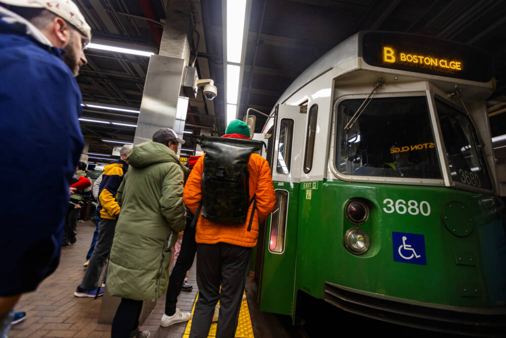 Riders wait to board a Green Line trolley. (Jesse Costa/WBUR)