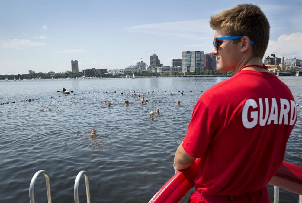 A lifeguard watches over swimmers in the Charles River at City Splash. (Robin Lubbock/WBUR)