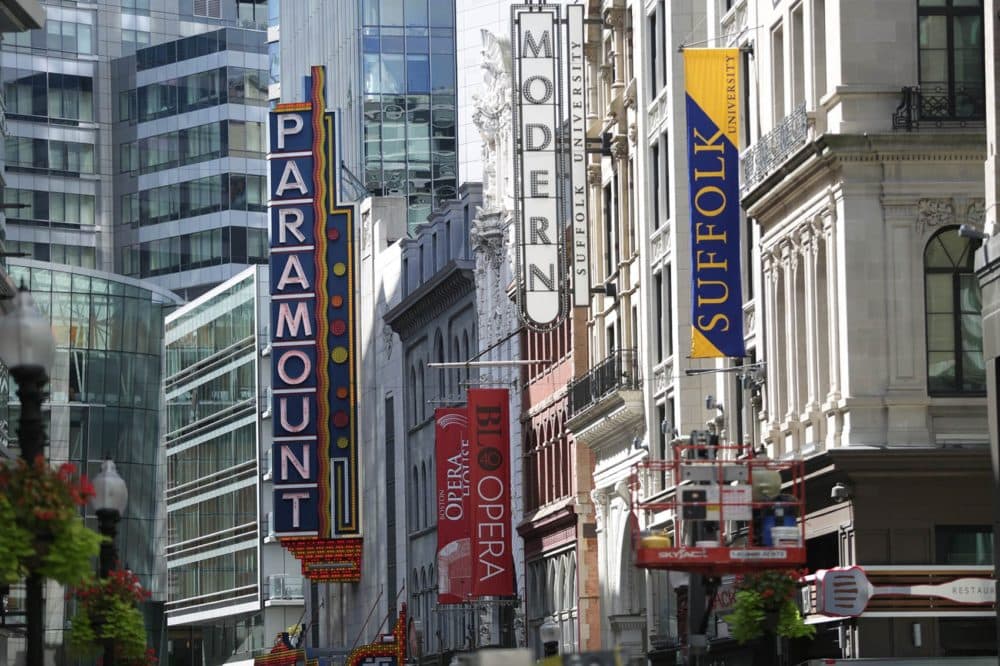 Signs for the Paramount, Opera House and Modern looking down Washington St. in the Theater District. (Jesse Costa/WBUR)