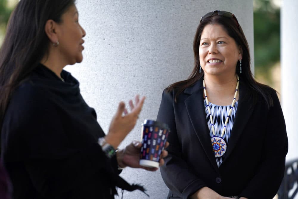 Chief Maggie Dana of the Passamaquoddy Tribe at Pleasant Point, right, listens to Tribal Rep. Rena Newell following the passage of a bill at the State House in Augusta, Maine, that allows the tribes to regulate their own drinking water and other water-related issues on Tuesday, April 12, 2022.
(Robert F. Bukaty/AP Photo)