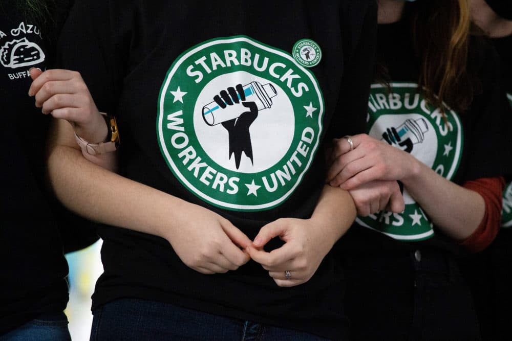 Starbucks employees and supporters react as votes are read during a union-election watch party. (Joshua Bessex/AP)