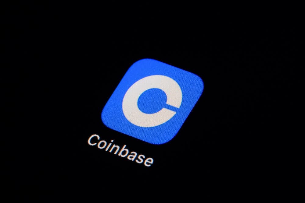 The Coinbase app icon is seen on a smartphone. (Matt Slocum/AP)