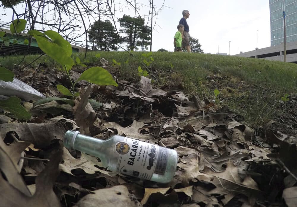 A discarded miniature bottle of Barcardi rum lies on the ground near Preble Street in Portland, Maine. (AP Photo/Robert F. Bukaty)