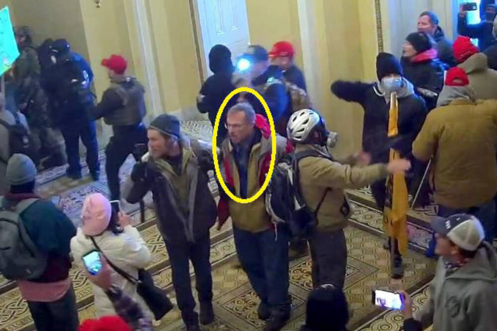 In this image from U.S. Capitol Police video, released and annotated by the Justice Department in the Statement of Facts supporting an arrest warrant, Joseph Robert Fisher appears inside the U.S. Capitol on Jan. 6, 2021, in Washington. (Courtesy Justice Department via AP)