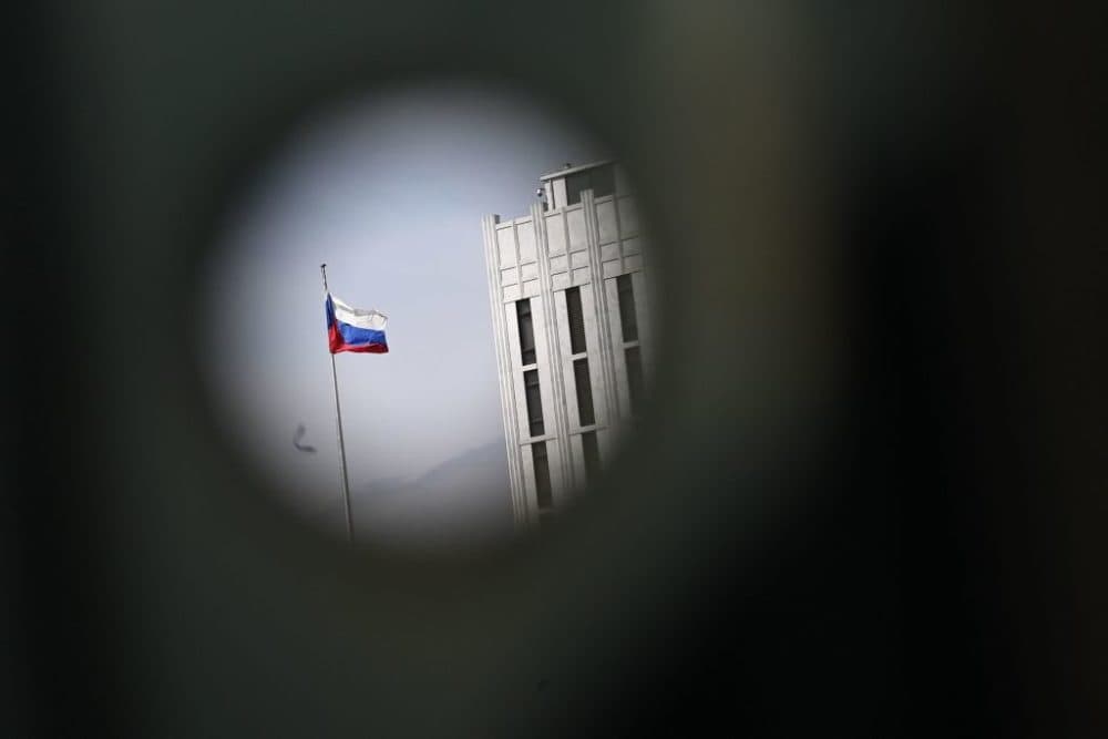 A Russian flag at the Embassy of Russia is seen through a bus stop post in Washington, DC on April 15, 2021. (MANDEL NGAN/AFP via Getty Images)