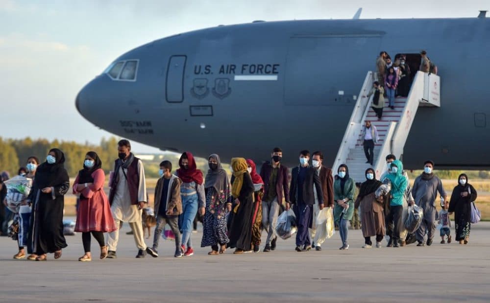 Refugees disembark from a U.S. air force aircraft after an evacuation flight from Kabul at the Rota naval base in Rota, southern Spain, on August 31, 2021. (Cristina Quicler/AFP via Getty Images)