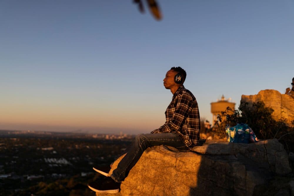 A man listens to music with headphones. (Guillem Sartorio/AFP via Getty Images)
